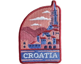 May include: Embroidered patch with a red, white, and blue color scheme. The patch features a stylized image of a city with a tall tower and the word "CROATIA" in blue lettering.