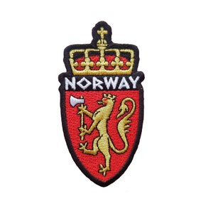 May include: Embroidered patch of the Norwegian coat of arms. It features a gold lion with an axe on a red shield, with the word "NORWAY" above. The patch has a black border and a gold crown at the top.
