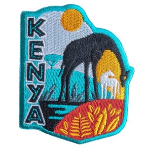May include: Embroidered patch featuring a black giraffe and a white animal grazing in a savanna landscape. The word "KENYA" is vertically embroidered in black letters on a turquoise background, with a yellow sun in the sky. The patch has a turquoise border.