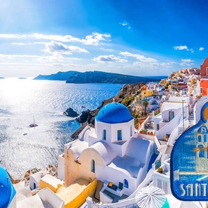 May include: A panoramic view of Santorini, Greece, with whitewashed buildings, blue-domed churches, and a bright blue sea. The image features a close-up of a souvenir patch with the word "Santorini" embroidered on it.