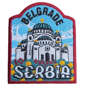 May include: Embroidered patch featuring the Belgrade cityscape with the text "BELGRADE" above and "SERBIA" below. The patch has a red border, a blue sky background, and a white building with green domes.