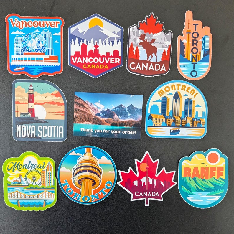 May include: A selection of vibrant travel stickers showcasing Canadian destinations. The designs include the CN Tower, a maple leaf, and cityscapes of Vancouver, Toronto, and Montreal. A small card reads "Thank you for your order!"
