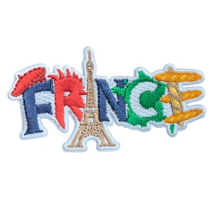May include: Embroidered patch spelling "FRANCE" in various colours. The design includes a beret, the Eiffel Tower, and a baguette. The patch is outlined in white and has a travel or souvenir theme, perfect for clothing or bags.