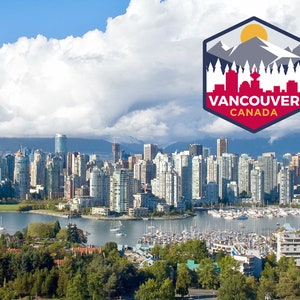 May include: A panoramic view of Vancouver, Canada, showcasing a cityscape with many high-rise buildings along a waterfront. A logo with the text "Vancouver Canada" is in the upper right corner. The sky is filled with clouds, and mountains are visible in the background.
