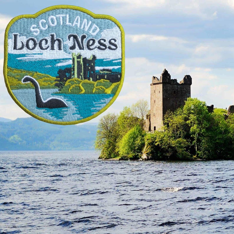 May include: Embroidered patch featuring the text "Scotland Loch Ness" with an image of the Loch Ness Monster and a castle. The patch has a blue, green, and yellow color scheme. The background shows a castle on a small island.