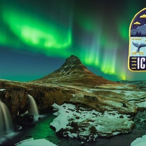 May include: An embroidered patch featuring an Iceland landscape with a whale, mountains, and buildings, set against a backdrop of the Northern Lights. The word "ICELAND" is displayed in white text.