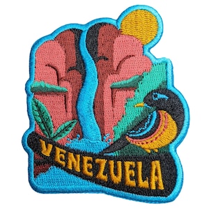 May include: Embroidered patch featuring a colorful design of Venezuela. The patch includes a bird, waterfall, and mountains in shades of red, teal, and blue. The word "VENEZUELA" is embroidered in yellow.