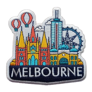 May include: Embroidered patch showing Melbourne landmarks, including a Ferris wheel, skyscrapers, and hot air balloons. The word "MELBOURNE" is embroidered in white on a navy blue banner. The patch has a white border, and is suitable for sewing onto clothing or bags.