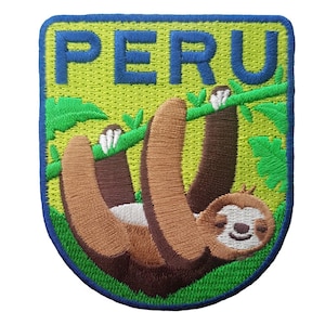 May include: Embroidered patch featuring a sloth hanging from a branch, with the word "PERU" in green letters on a yellow background. The patch has a blue border and is designed with detailed stitching.