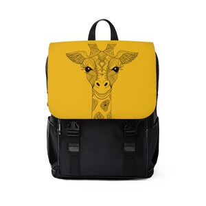 May include: A black backpack with a yellow front panel featuring a black and white line drawing of a giraffe's head with intricate details.