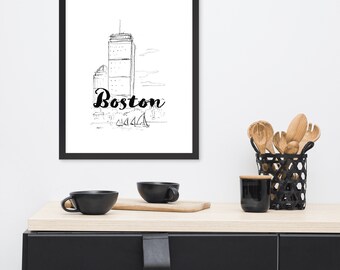 May include: Black framed art print with a monochrome sketch of the Boston skyline, including a tall building and sailboats. The word "Boston" is written in cursive below the skyline.