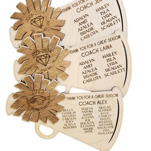 May include: Three wooden megaphones with the text "Thank you for a great season!" and the names of coaches and players. The megaphones are decorated with a diamond and an eagle.
