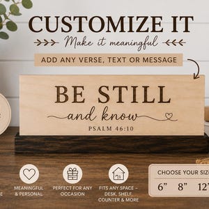 May include: A rectangular light wood sign with dark brown engraved text reading BE STILL and know PSALM 46:10, featuring a small heart icon. The sign is mounted on a dark brown wooden base. The image includes text options for 6, 8, and 12 inches.
