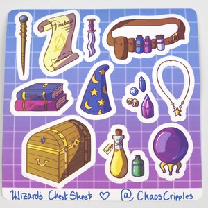 May include: A sticker sheet with a wizard theme. It features a variety of magical items, including a wand, a scroll, a book, a chest, a potion bottle, a crystal ball, a hat, a belt with potion bottles, a necklace, and crystals. The text on the sheet reads "Wizard's Chest Sheet" and "@ChaosCripples".