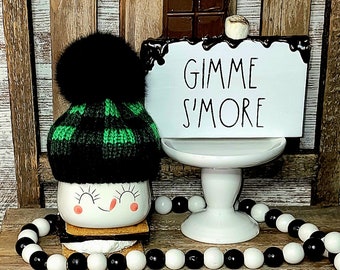 Two Piece Set: Green and Black Buffalo Plaid Marshmallow Mug Hat with Black Faux Fur Pom and Gimmie S'more Sign for Fall/ Winter Coffee Bar