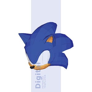 May include: A low-poly 3D model of a blue hedgehog head with large pointed ears, a tan muzzle, and a small black nose. The design features sharp geometric facets and includes the text Digital Pepakura Templates vertically on the side.
