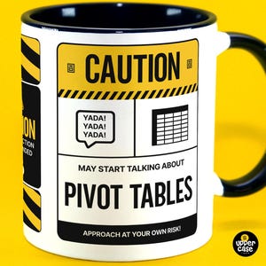 May include: White ceramic mug with a black handle. The mug has a yellow and black caution sign with the text "CAUTION" and "MAY START TALKING ABOUT PIVOT TABLES" in black. The text "APPROACH AT YOUR OWN RISK!" is also in black.