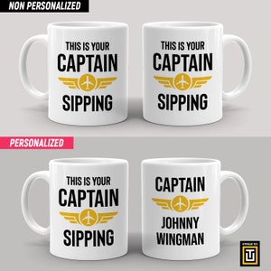 11oz white mug with a graphic of an aviator wings badge and the text this is your captain sipping on one side and personalized name on the other side