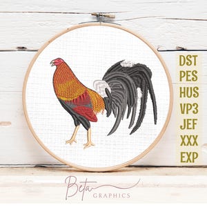 May include: Embroidered rooster design in a wooden hoop. The rooster features a red comb, orange and red body, and black and gray tail feathers. The design is on white fabric, with the text "Beta Graphics" at the bottom and file type abbreviations on the right.