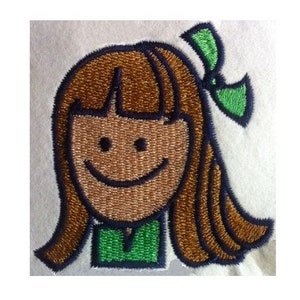 May include: Embroidered patch of a smiling girl with brown hair, wearing a green shirt and a green bow.