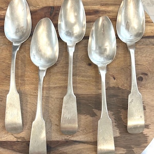 Antique coin silver spoons.