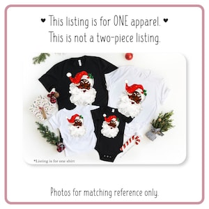 May include: Four t-shirts featuring a vintage illustration of a Black Santa Claus. The shirts are in various sizes and colors, including black and white. The text "This listing is for ONE apparel. This is not a two-piece listing." is displayed at the top of the image. The text "*Listing is for one shirt" is displayed at the bottom of the image.