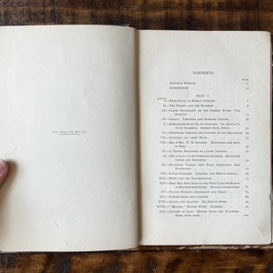 May include: A book with a white cover and black text. The title of the book is "From Natal to the Zambesi." The book is open to the table of contents, which lists the chapters and page numbers. The book is a travelogue about a journey through Africa.