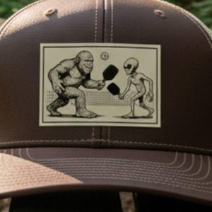 Bigfoot & Alien Pickleball Hat – Laser Engraved Patch Trucker Snapback, Funny Cryptid Hat, Pickleball Gift for Players