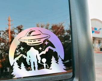 Bigfoot & Alien Holding Hands Holographic Vinyl Decal