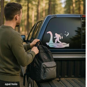 Bigfoot Fishing on Loch Ness with UFO – Funny Vinyl Decal for Car, Gift for Cryptid Believers, Funny Car Sticker for Cryptid Lovers