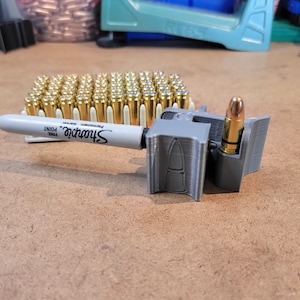 Marcador de pistola de latão