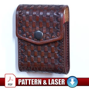 May include: Brown leather case with a woven pattern and a snap closure. The case has a flap and a dark metal button. The text "CRAFTY BUILT" is visible on the bottom of the case. The words "PATTERN & LASER" are also visible.