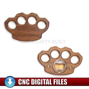 May include: Two wooden bottle openers in the shape of brass knuckles. One is plain wood, the other has a bottle opener insert. The text "CRAFTY BUILT" is visible. The bottom of the image has the text "CNC DIGITAL FILES".
