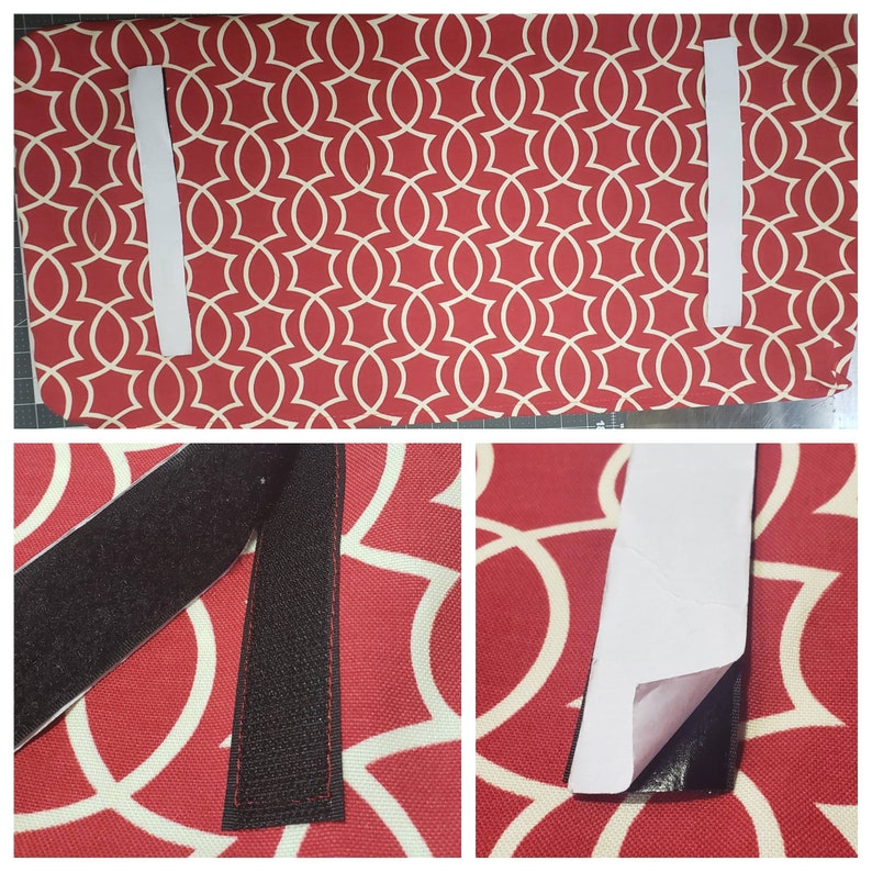 May include: A rectangular ironing board cover featuring a red fabric base with a white geometric interlocking pattern. Two white adhesive-backed hook-and-loop fastener strips are attached to the surface, with black fabric backing visible.