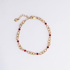 Pulseira Valora - Pulseira de cristal vermelho preenchida com ouro 14k