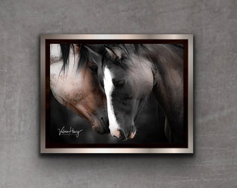 May include: A framed photograph of two horses with black and white markings, nuzzling each other. The horses are in a dark setting, and the photograph is signed "Valerie Hay" in the bottom left corner.