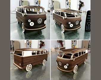 May include: A wooden model of a classic Volkswagen van, with a brown wood exterior and white trim. The model is detailed with windows, headlights, and a Volkswagen logo.