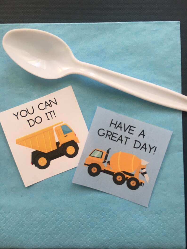 May include: Two motivational cards with construction vehicle illustrations. The first card says "You can do it!" and features a yellow dump truck. The second card says "Have a great day!" and features a yellow cement mixer.