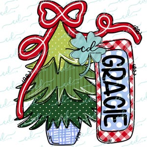 May include: A red and white gingham sign with the name "GRACIE" in black letters on a blue background with white polka dots. A green Christmas tree with a red bow is behind the sign.