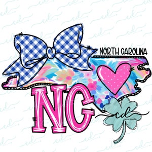 May include: A pink and white floral design of the state of North Carolina with a blue and white gingham bow, a pink heart, and the letters "NG" in pink. The text "NORTH CAROLINA" is written above the state outline. A green four-leaf clover is in the bottom right corner.