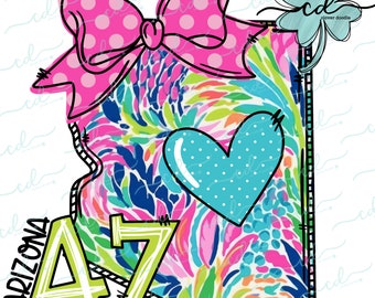 May include: A green and yellow outline of the state of Arizona with a pink and white polka dot bow, a blue heart with white polka dots, and the letters "AZ" in green and yellow. The background is a colorful floral pattern.