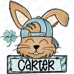May include: A cartoon bunny wearing a blue baseball cap with a white brim and a brown and white striped shirt. The bunny is smiling and has a name tag that says "Carter".