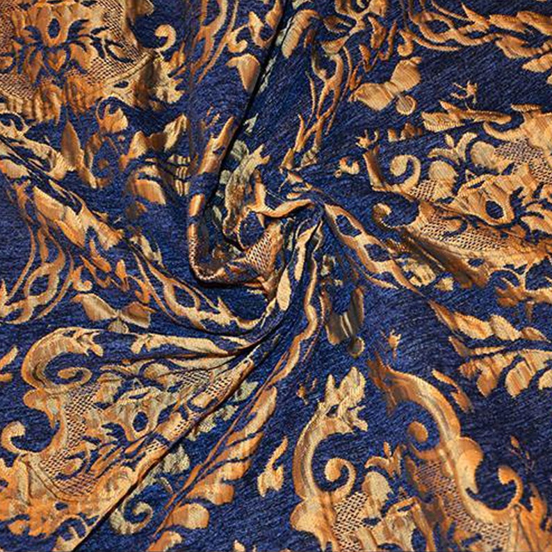 May include: Blue fabric with a gold damask pattern. The fabric is textured and has a subtle sheen.