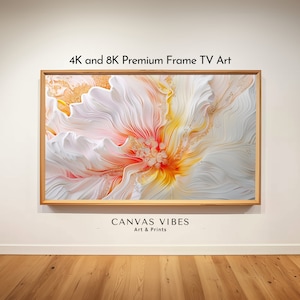 May include: A framed abstract art print with a white, yellow, and orange flower design. The print is titled "CANVAS VIBES Art & Prints" and is labeled "4K and 8K Premium Frame TV Art".
