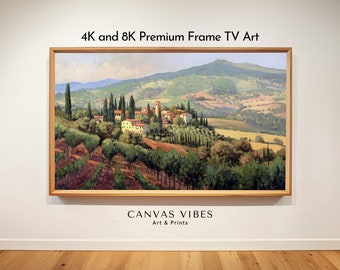 Puede incluir: Una pintura de paisaje enmarcada de un pequeño pueblo ubicado en un valle con colinas onduladas y una montaña en el fondo. La pintura se exhibe en una pared blanca con un piso de madera. El texto "4K and 8K Premium Frame TV Art" está sobre la pintura y "CANVAS VIBES Art & Prints" está debajo de la pintura.