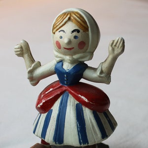 Logotipo de la tienda de lana Bergère de France, estatua publicitaria de una niña