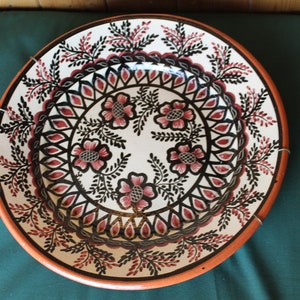 Hand painted Italian decorative plate; Vintage earthenware plate decorated with a cream background and black and red flowers