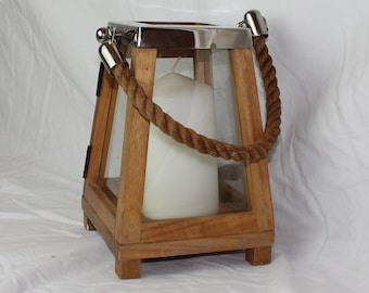 Wooden Lantern candle holder, elegant chrome top with rope handle and glass panels.