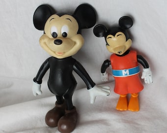 Two Mickey Mouse models, Vintage toys, one plastic model and a swimming bath toy