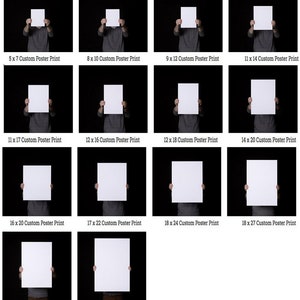 May include: A collection of white custom poster prints in various sizes, held by a person against a black background. Sizes include 5x7 inches, 8x10 inches, and up to 24x36 inches. Each print has the size printed on it.
